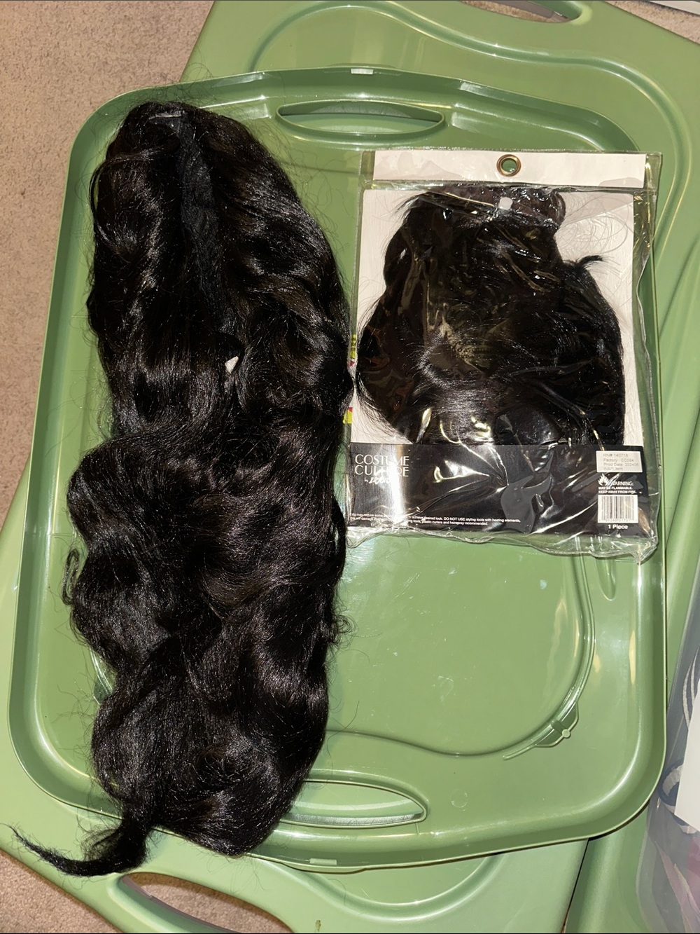 Two Black Hair Women’s Costume Wigs; one long wavy and one short Peggy Sue bob